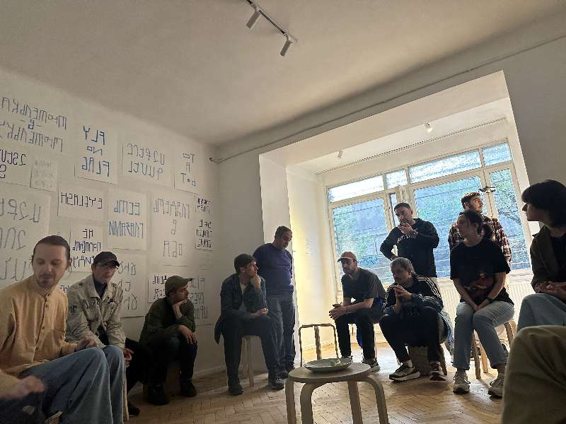 audience listening to an artist talk